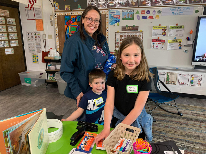 Family smiling for photo at C-FC Literacy Night