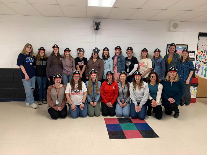 Literacy Night participants wearing homemade pirate hats